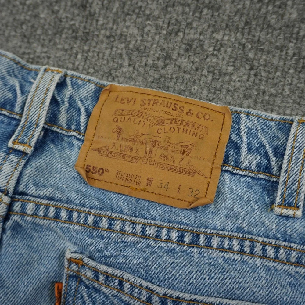 Vintage Levis 550 Relaxed Fit Tapered Mens Light Wash Orange Tab Jeans 34x32 90s
